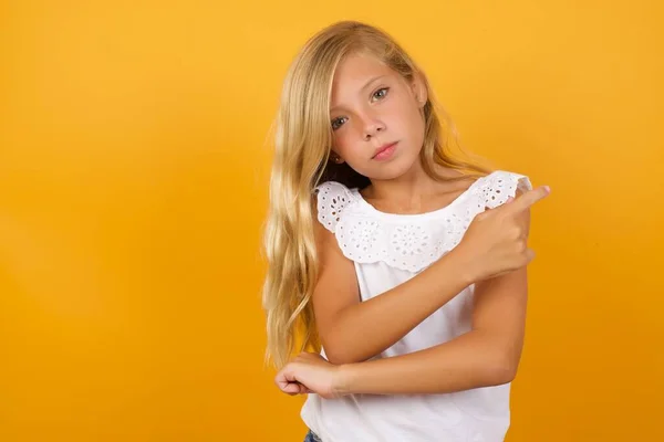 Cute Girl Pointing Yellow Background — Stock Photo, Image