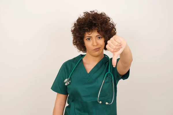 Discontent Beautiful Arab Doctor Woman Wearing Medical Uniform Shows Disapproval — Stock Photo, Image