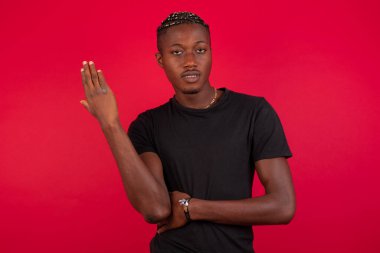 What the hell are you talking about, nonsense. Studio shot of frustrated  gesturing with raised palm, frowning, being displeased and confused with dumb question over wall.