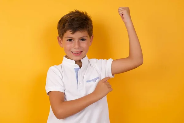 Cute Boy Showing Muscle Yellow Wall — Stock Photo, Image