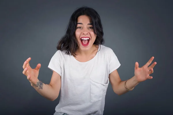 Portrait Beautiful Brunette Woman Looks Excitement Camera Keeps Hands Raised — Stock Photo, Image