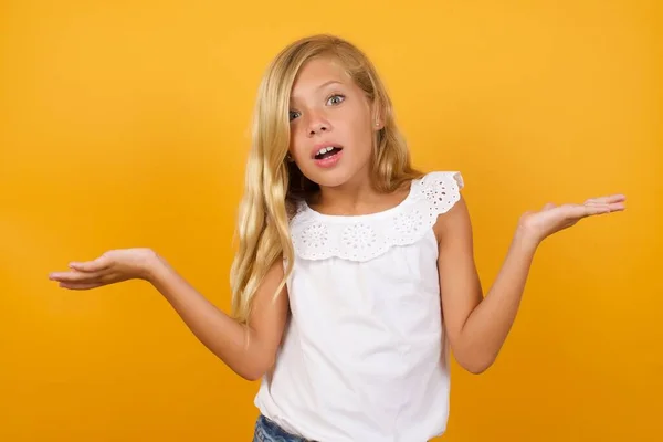 Cute Girl Confused Yellow Background — Stock Photo, Image