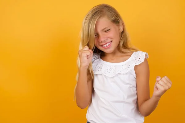 Cute Girl Fists Yellow Background — Stock Photo, Image