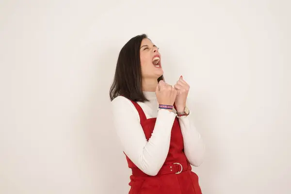 Brunette Girl Excited Glad Achieve Victory Clenches Fists Screams Excitement — Stock Photo, Image