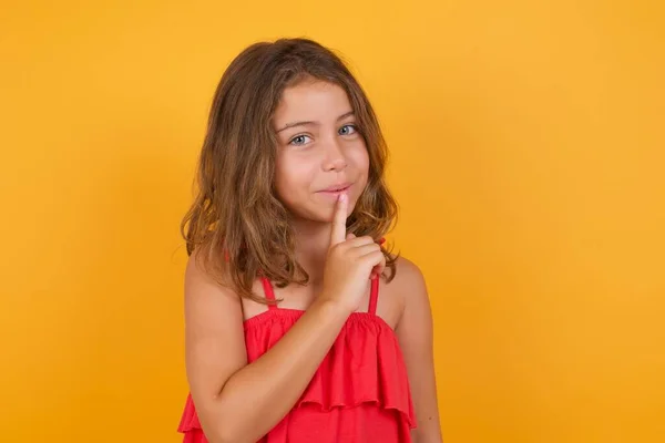 Cute Little Girl Wearing Red Dress Silence Gesture Yellow Background — Stock Photo, Image