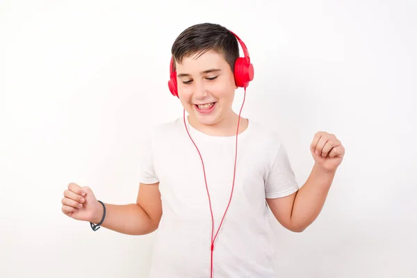 Young Boy Wearing Casual Clothes White Wall Dancing Listening Music — Stock Photo, Image