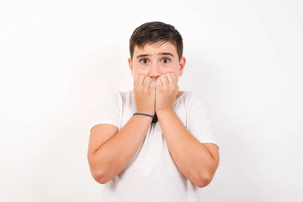 Beautiful Young Caucasian Boy Covering His Mouth Hands Standing Indoors — Stock Photo, Image