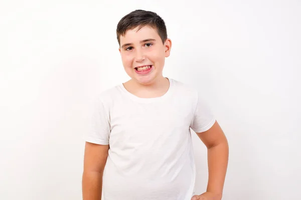 Studio Shot Cheerful Boy Keeps Hand Hip Smiles Broadly Anticipates — Stock Photo, Image