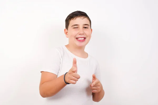 Joyful Charismatic Good Looking Emotive Boy Winking Pointing Finger Pistols — Stock Photo, Image