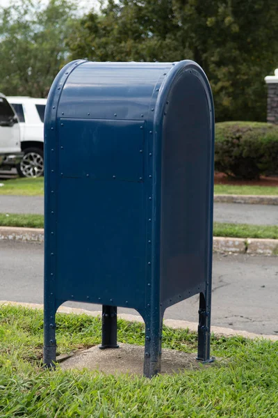 blue us mailbox on sidewalk post offise postal drop slot