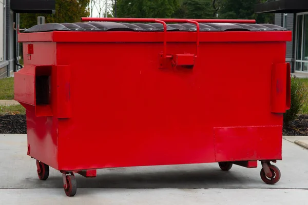 big red trash can
