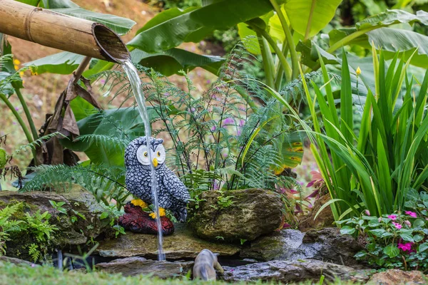 cute owl statue in garden