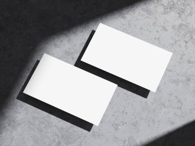 Temiz ve modern kartvizit kabataslak çimento arka planı.