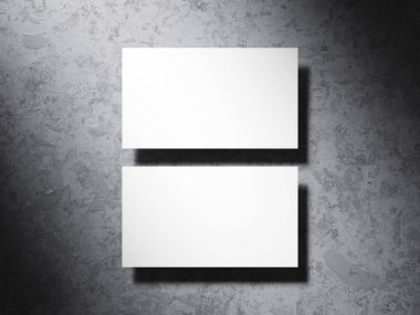 Dikey olarak desenli çimento yüzeyine yerleştirilmiş zarif kartvizit..