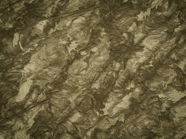 Kalın çizgiler ve doğal toprak tonlarıyla desenli kaya arkaplanı.