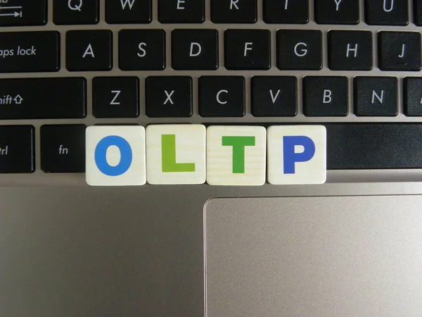 Abbreviation OLTP (Online Transaction Processing) on keyboard background