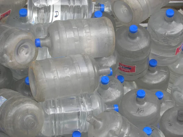 Many Plastic Packaged Drinking Water Bottles — Stock Photo, Image