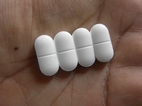 Small Oblong Shape White Medicine Pills Palm Hand — Stock Photo, Image
