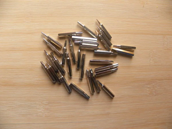 Many Steel Bits Precision Screwdriver Kept Wooden Table — Stock Photo, Image