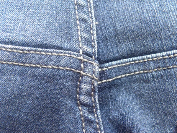 蓝色牛仔裤上的补丁 — 图库照片
