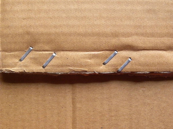 Front side staples on brown color cardboard box