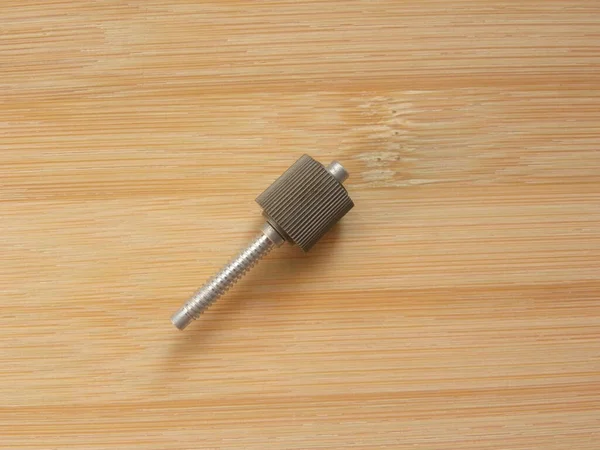 Small Cylindrical Metal Screw Kept Wooden Table — Stock Photo, Image
