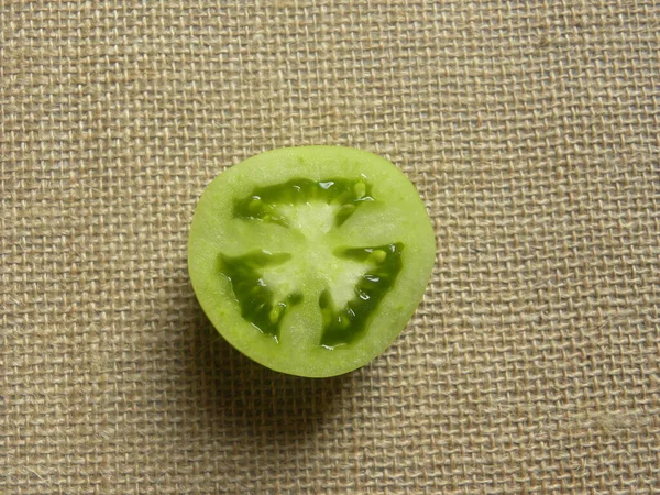 Sliced Cut Green Color Fresh Unripe Tomato — Stock Photo, Image