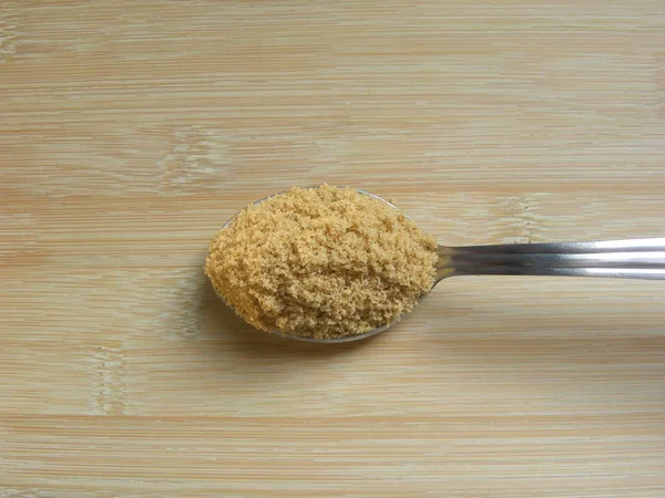 Braune Farbe Zuckerpulver Auf Edelstahllöffel — Stockfoto