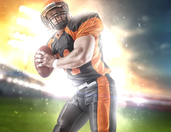 American football player at the stadium in black and orange outfit.