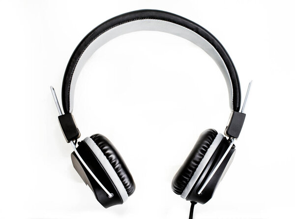 Black headphones isolated white background.
