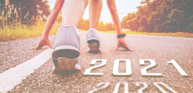 Start 2021 symbolises the start into new year. The start of people running on street is healthy new normal, with sunset light. Goal of Success clipart