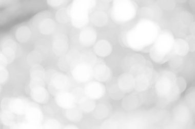 Beyaz bulanık arkaplan. Bokeh Noel 'i güzel, parlak Noel ışıklarını bulanıklaştırdı