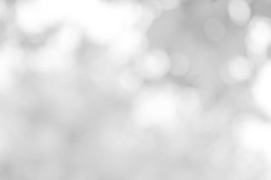 Beyaz bulanık arkaplan. Bokeh Noel 'i güzel, parlak Noel ışıklarını bulanıklaştırdı