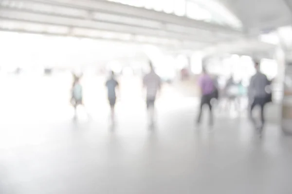 white blurred of people walking in city town. Defocused blur background.