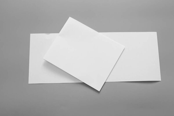 Blank portrait mock-up paper. brochure magazine isolated on gray, changeable background / white paper isolated on gray