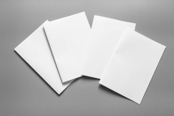 Blank portrait mock-up paper. brochure magazine isolated on gray, changeable background / white paper isolated on gray