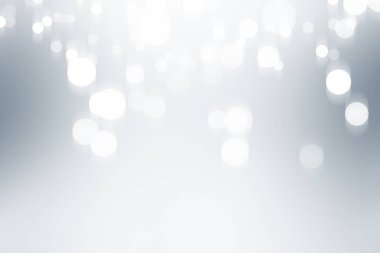 Beyaz bulanık arkaplan. Bokeh Noel 'i güzel, parlak Noel ışıklarını bulanıklaştırdı