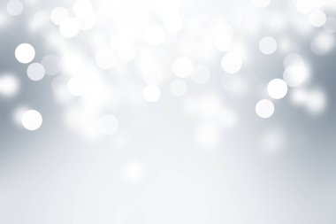 Beyaz bulanık arkaplan. Bokeh Noel 'i güzel, parlak Noel ışıklarını bulanıklaştırdı