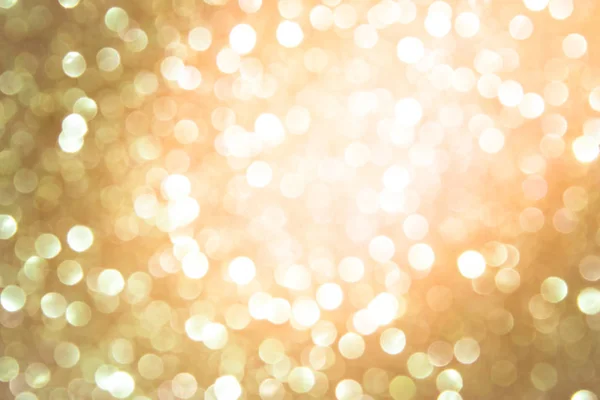 golden blur abstract background. yellow bokeh christmas blurred beautiful shiny Christmas lights