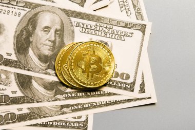 bitcoin and gold coin on a white background