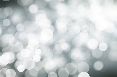 Beyaz bulanık arkaplan. Bokeh Noel 'i güzel, parlak Noel ışıklarını bulanıklaştırdı