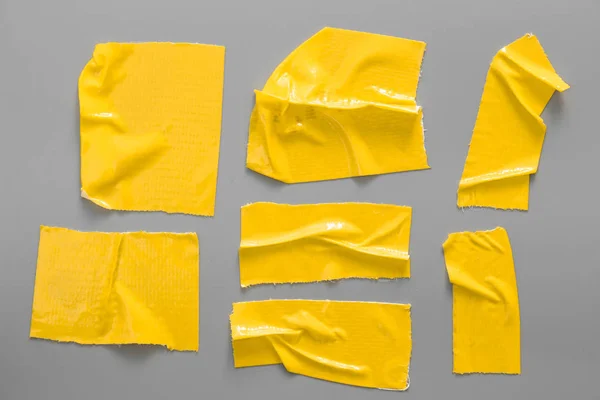 灰色背景上的黄色磁带集 撕裂水平和不同尺寸的黄色胶带 粘合件 — 图库照片