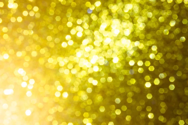 golden blur abstract background. yellow bokeh christmas blurred beautiful shiny Christmas lights