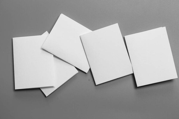 Blank portrait mock-up paper. brochure magazine isolated on gray, changeable background / white paper isolated on gray