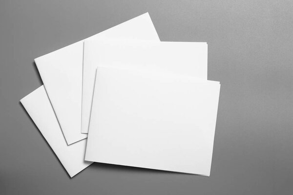 Blank portrait mock-up paper. brochure magazine isolated on gray, changeable background / white paper isolated on gray