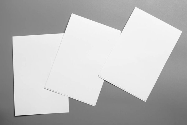 Blank portrait mock-up paper. brochure magazine isolated on gray, changeable background / white paper isolated on gray