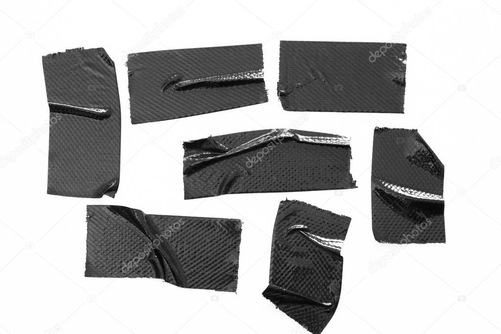 Set of black tapes on white background. Torn horizontal and different size black sticky tape, adhesive pieces.