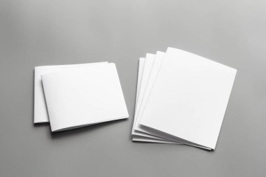 Blank portrait mock-up paper. brochure magazine isolated on gray, changeable background / white paper isolated on gray clipart