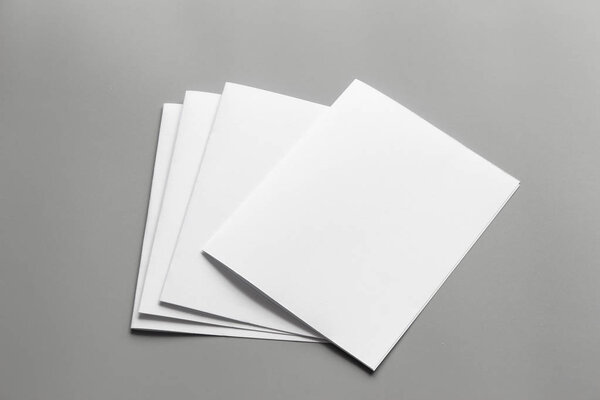 Blank portrait mock-up paper. brochure magazine isolated on gray, changeable background / white paper isolated on gray