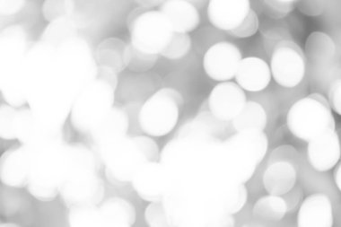 Beyaz bulanık arkaplan. Bokeh Noel 'i güzel, parlak Noel ışıklarını bulanıklaştırdı